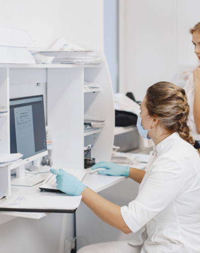 Healthcare worker looking at computer