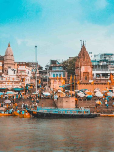 Boat docked by stairs along the Ganges River in Varanasi, India. Photo by Srivatsan Balaji.